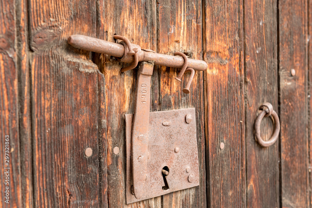 ood old door with round metal knobs for exterior design. Antique and grunge style. Brown wooden surface door photography image ood old door with round metal knobs for exterior design. Antique and grunge style. Brown wooden surface door photography image