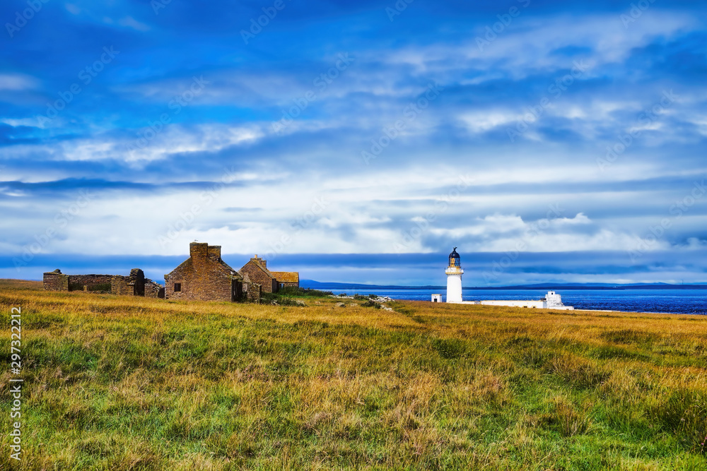 Stroma Lighthouse, abandoned houses, and the Pentland Firth Stroma Lighthouse, abandoned houses, and the Pentland Firth