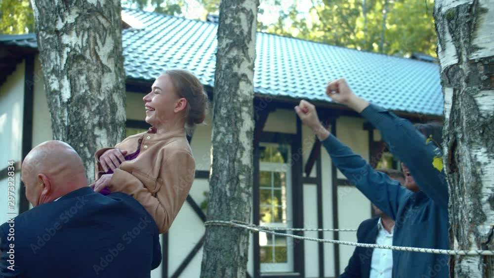 Collegues put up woman under the rope. Collegues put up woman under the rope.