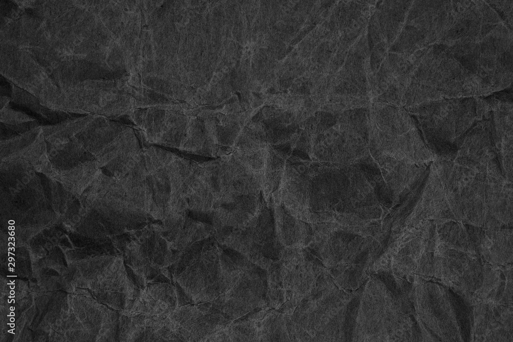 Fototapeta premium Black crumpled packaging paper background texture. Dark Kraft Paper Coarse. Wrinkled paper bag