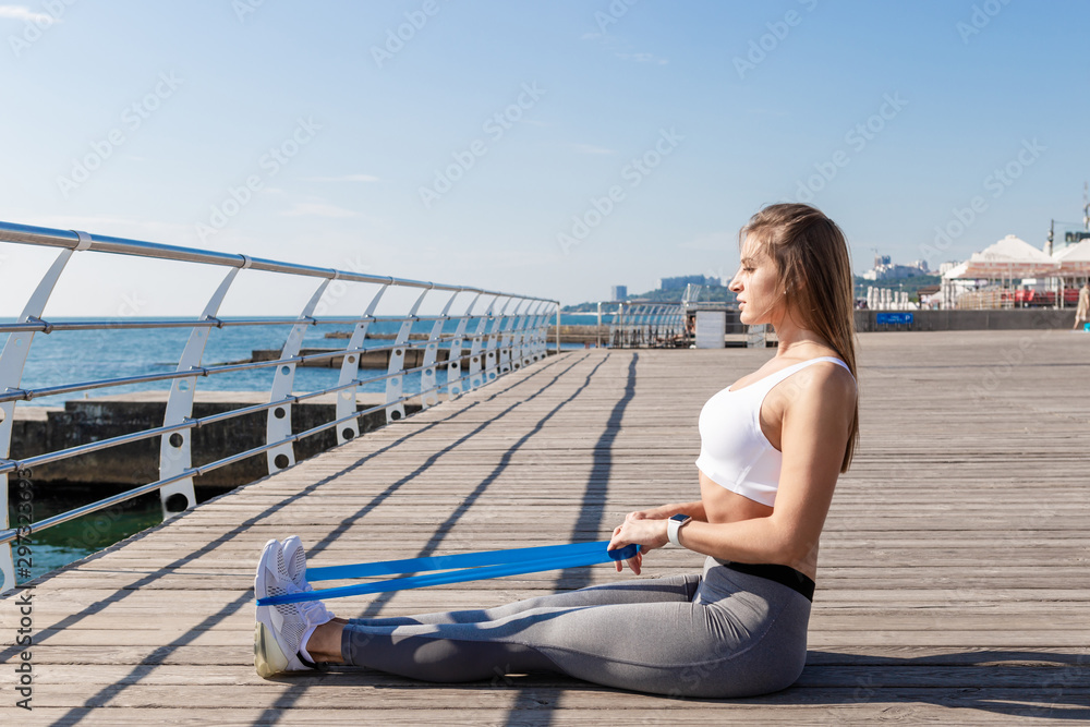Sport woman doing stretching exercises.