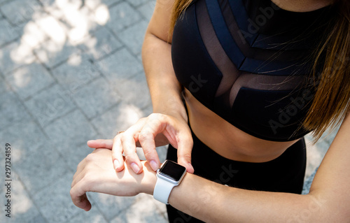Close up view of woman wrist with activity trcker.
