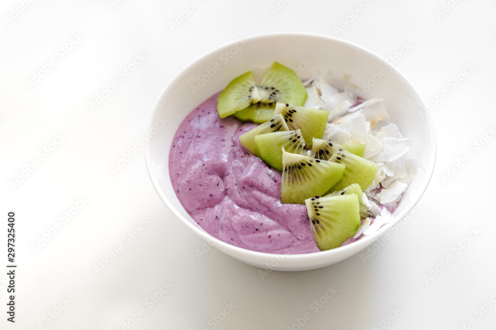 berry smoothie bowl with kiwi and coconut slices berry smoothie bowl with kiwi and coconut slices