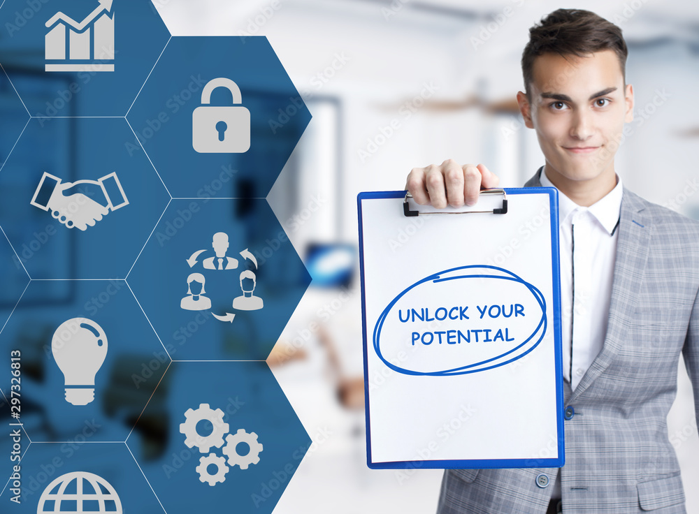 Business, technology, internet and network concept. Young businessman shows a keyword: Unlock your potential Business, technology, internet and network concept. Young businessman shows a keyword: Unlock your potential