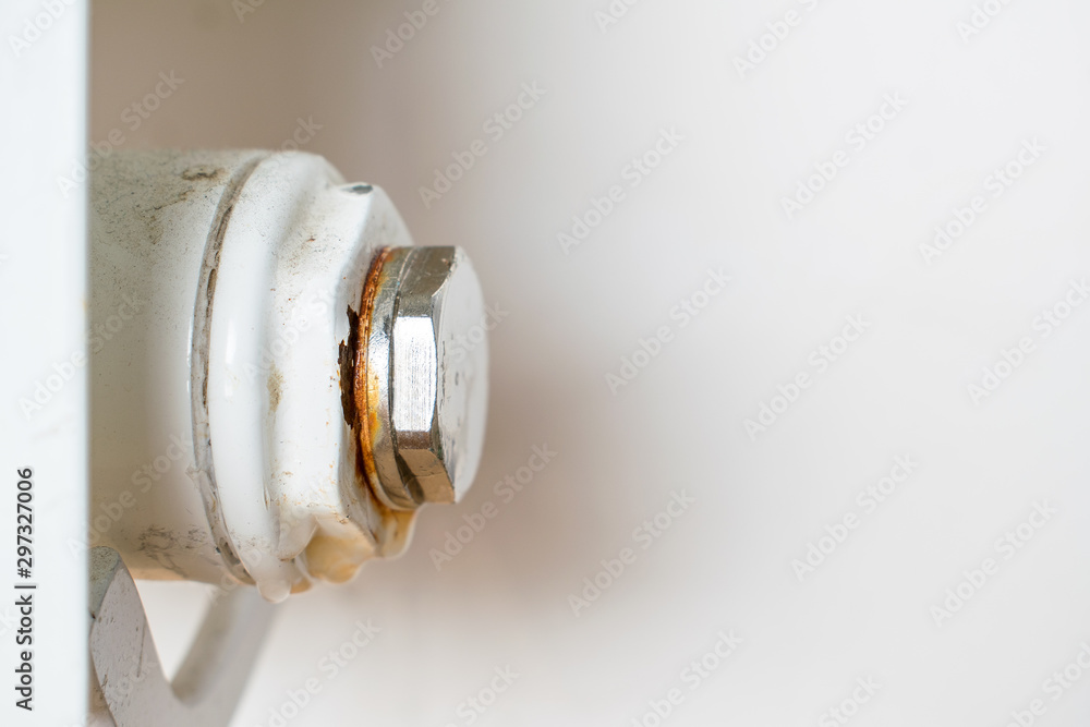 Rusty plug of a central heating radiator. Point of leakage. Rusty plug of a central heating radiator. Point of leakage.