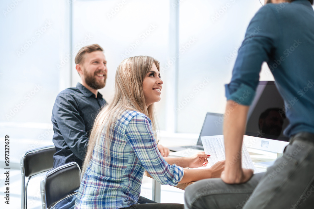Fototapeta premium young employee discussing business documents with colleagues