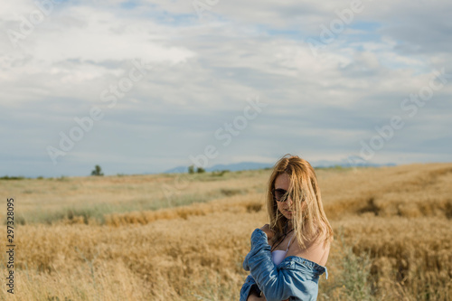 Beautiful young woman in a field