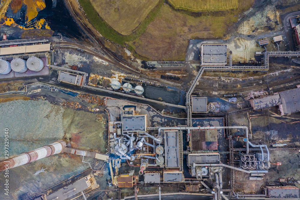Aerial drone view of industrial area of refractory plant. Fuming pipes of factory