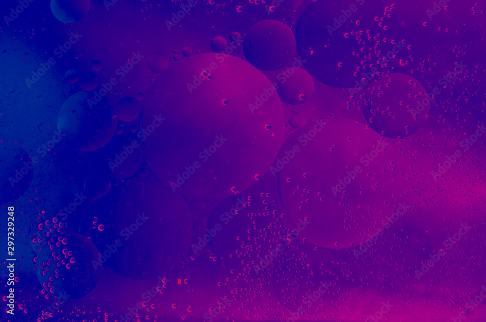 Macro shot of water oil emulsion over colored background - obrazy, fototapety, plakaty 