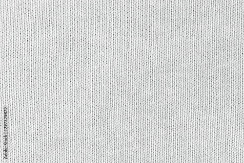 White natural texture of knitted wool textile material background. White cotton fabric woven canvas texture photo