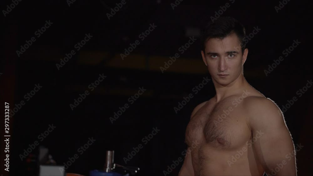 Confident Athlete Look In The Gym. On the way to great shape. Man muscular torso tense muscles holds denim pants. Macho muscular chest looks attractive black background. Athlete with muscular body on Confident Athlete Look In The Gym. On the way to great shape. Man muscular torso tense muscles holds denim pants. Macho muscular chest looks attractive black background. Athlete with muscular body on
