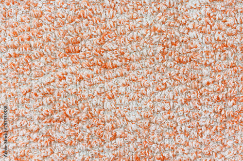 Texture of orange knitted textile material background