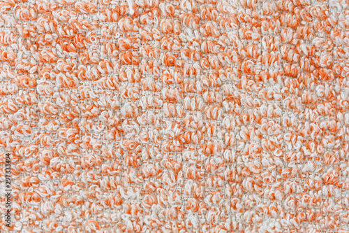 Texture of orange knitted textile material background