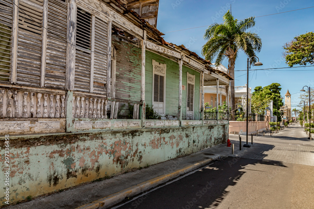 Caribbean old city street, church, independence square, tropical plants , palm tree, mountain view, Puerto Plata, Dominican Republic