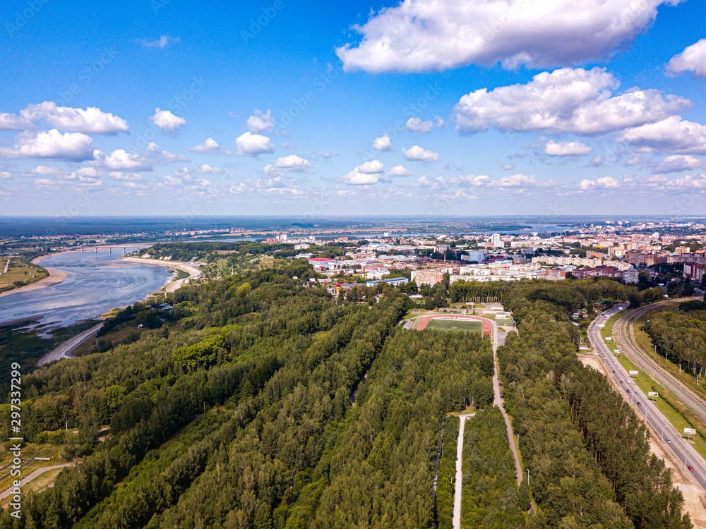 Tomsk cityscape from aerial view. Tom river. Modern green city. Siberia, Russia 