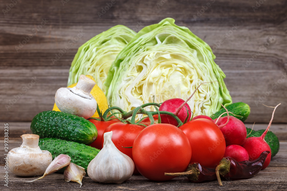 Fresh vegetables on a cutting board with a knife