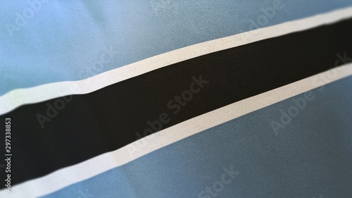 locked full-screen close shot of the national flag of Botswana. The banner/emblem is made of realistic satin texture and rendered in a daylight situation. T photo