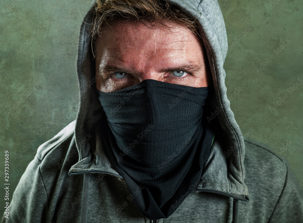 young man as fanatic and aggressive anarchist rioter . furious and scary violent anti-system protester in face mask hostile at fighting riot in radical demonstration isolated young man as fanatic and aggressive anarchist rioter . furious and scary violent anti-system protester in face mask hostile at fighting riot in radical demonstration isolated