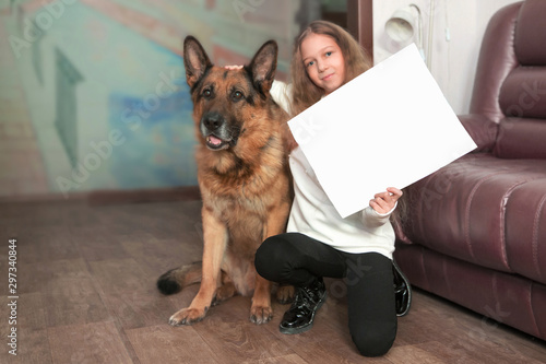teenage girl showing her drawing depicting her dog