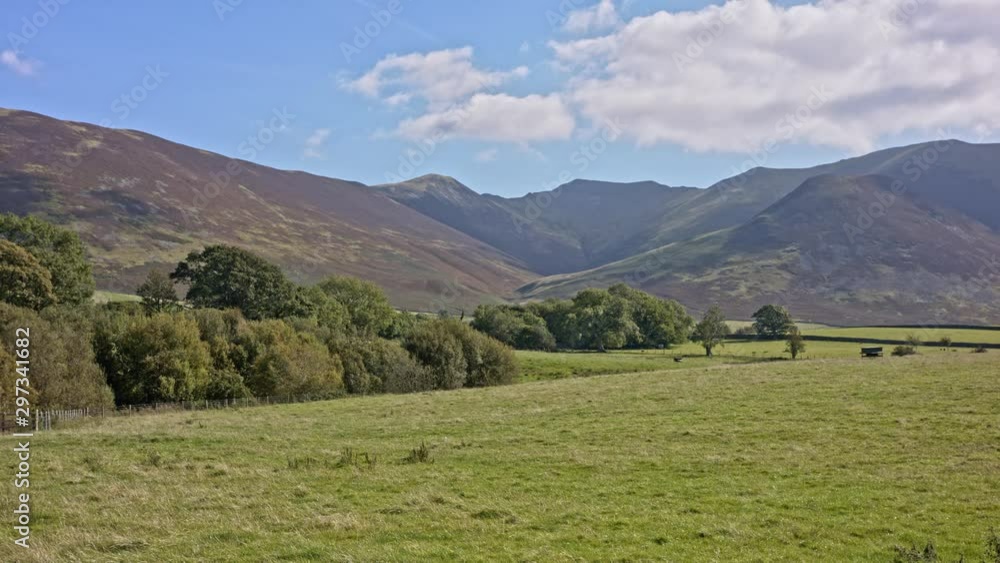 Landscape, panoramic vista overlooking pasture towards valley and mountains. Landscape, panoramic vista overlooking pasture towards valley and mountains.