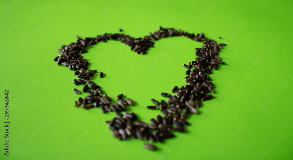 Milk thistle seeds on the background.Health and beauty.Vegan and Vegetarian. Milk thistle seeds on the background.Health and beauty.Vegan and Vegetarian.