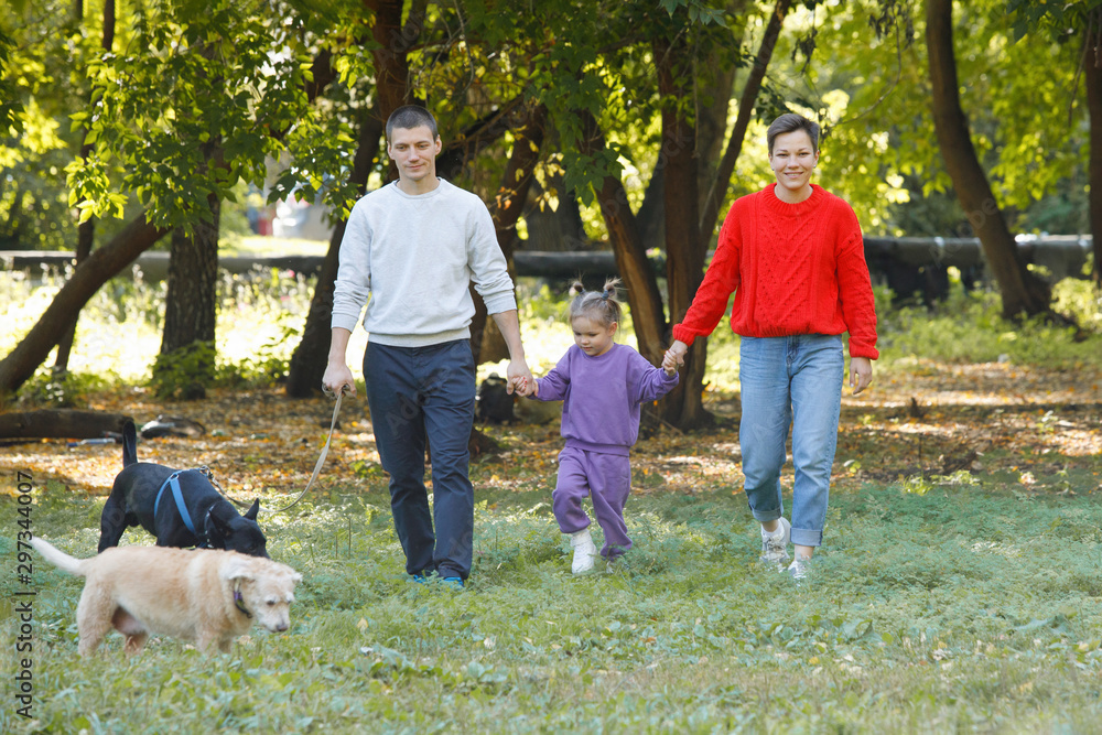 Obraz premium Young family with Dogs.