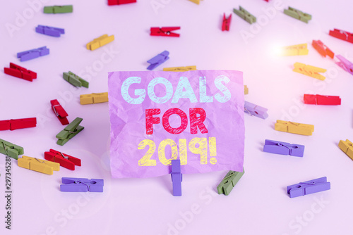 Writing note showing Goals For 2019. Business concept for object of demonstratings ambition or effort aim or desired result Colored clothespin papers empty reminder white floor background office