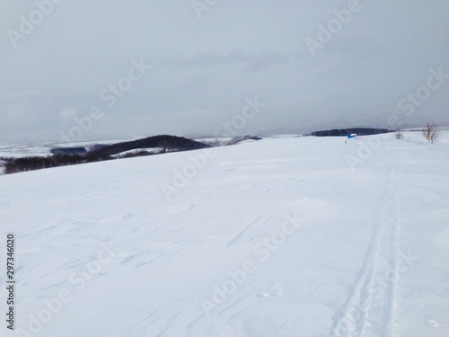 Winter in Mountains with Track of Walking Ski on Snow