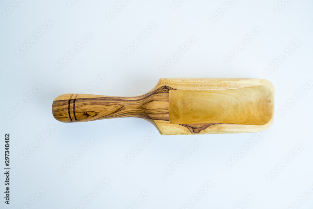 Traditional wood object wooden scoop or spoon isolated on a white background from various angle and top view Traditional wood object wooden scoop or spoon isolated on a white background from various angle and top view
