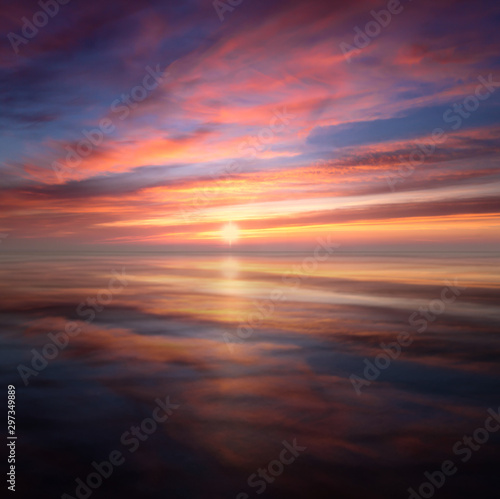 Mirrored Glowing Sky Sunset on beach in North Cornwall © mickblakey