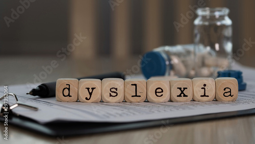 Word DYSLEXIA composed of wooden dices.