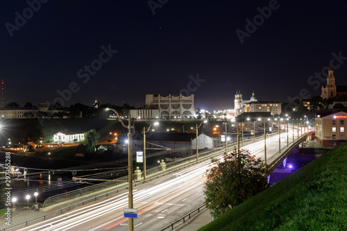 Embankment, the Neman River and the Old Bridge in Grodno. Night view of the city and the Old Bridge
