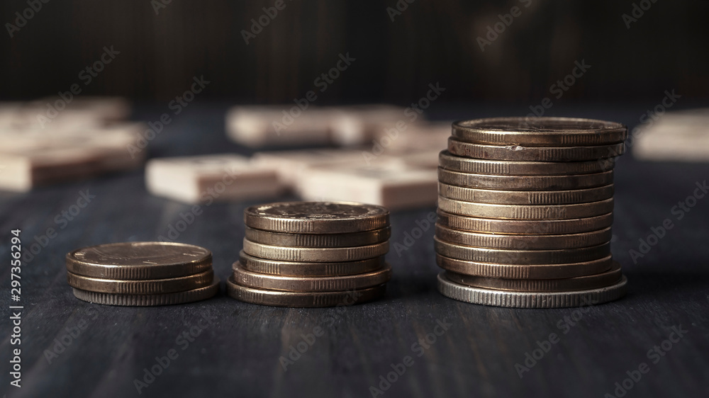 Stucks of coins on the wooden table Stucks of coins on the wooden table