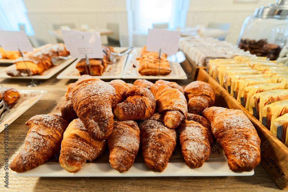 Sweet french croissants pastry with jam and cream