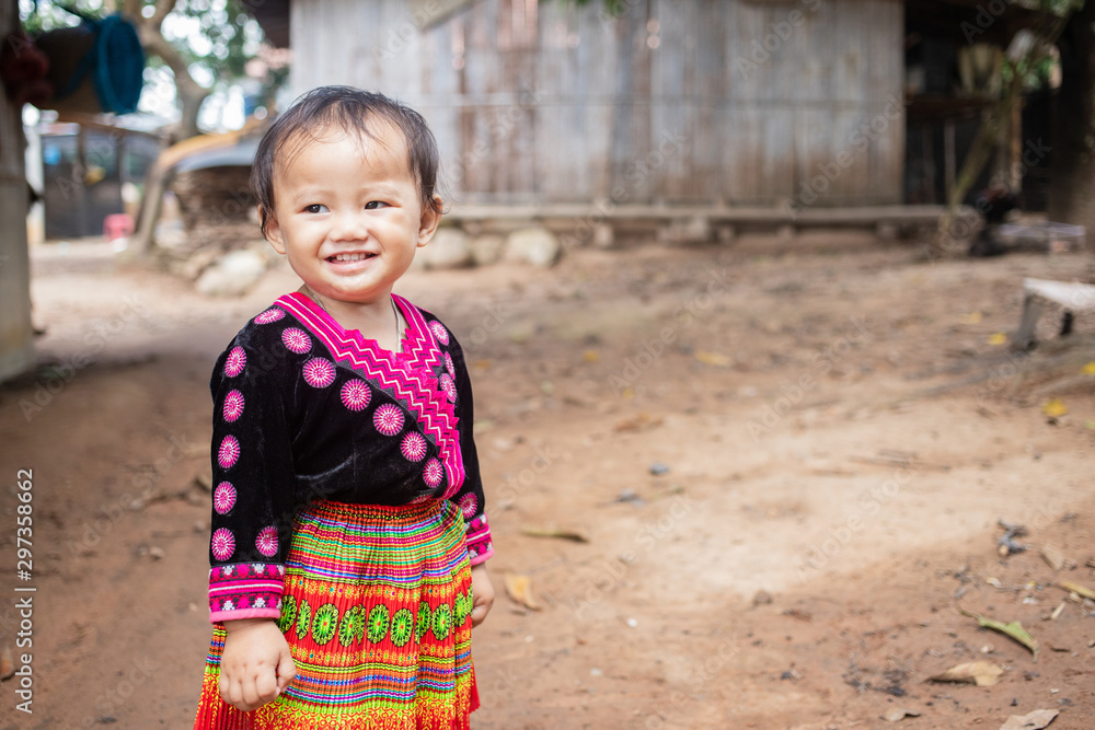 Portrait of Little girl in Hmong clothes, Hmong kid smiling beautifully Portrait of Little girl in Hmong clothes, Hmong kid smiling beautifully