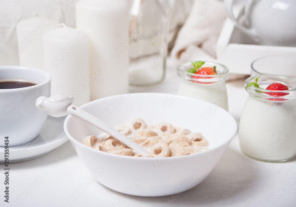 Delicious and nutritious cereal loops in a bowl with milk for healthy breakfast for kids Delicious and nutritious cereal loops in a bowl with milk for healthy breakfast for kids