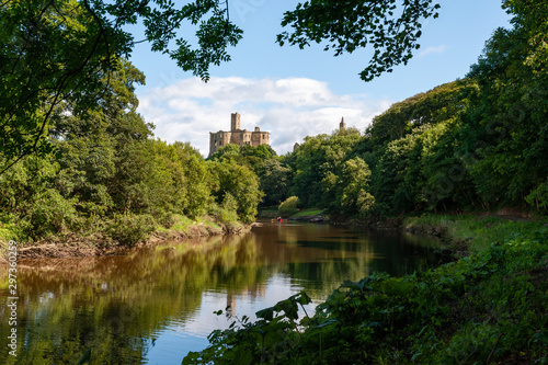 Warkworth Castle and the River Coquet in Morpeth, Northumberland, UK on a sunny day photo