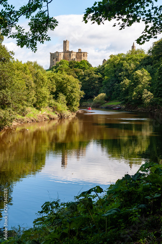 Warkworth Castle reflected in the River Coquet, Morpeth, Northumberland, UK photo