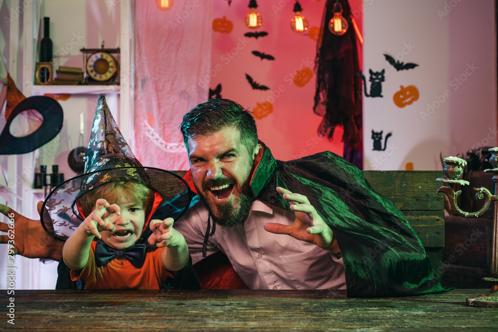 Happy Halloween Family celebration. Father and son celebrate at home together.