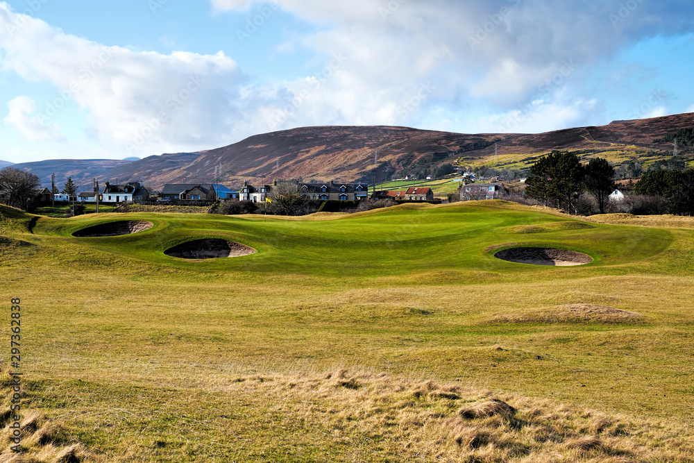 Approach to the 6th green on Brora Golf Course showing the bunkers