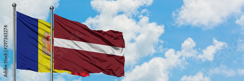 Andorra and Latvia flag waving in the wind against white cloudy blue sky together. Diplomacy concept  international relations.