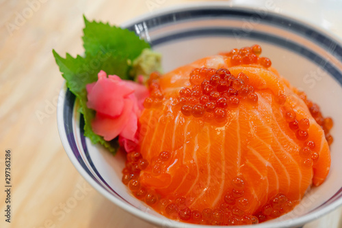 Japanese food Salmon sashimi, salmon's egg (ikura), shredded radish and slice ginger with japanese rice donburi,Salmon don.