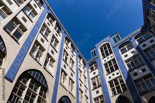 Hackesche Höfe, Berlin, Germany. Beautiful architecture, blue sky in the background. Notable courtyard complex situated next to the Hackescher Mark, centre of the capital. Art nouveau.
