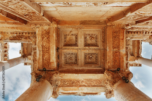 Elements of the columns of the architectural structure against the blue sky of the Library of Celsus in Ephesus, Turkey photo