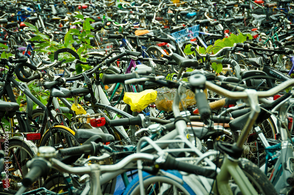 Many bicycles parking everywhere at the main station in Göttingen, Germany Many bicycles parking everywhere at the main station in Göttingen, Germany