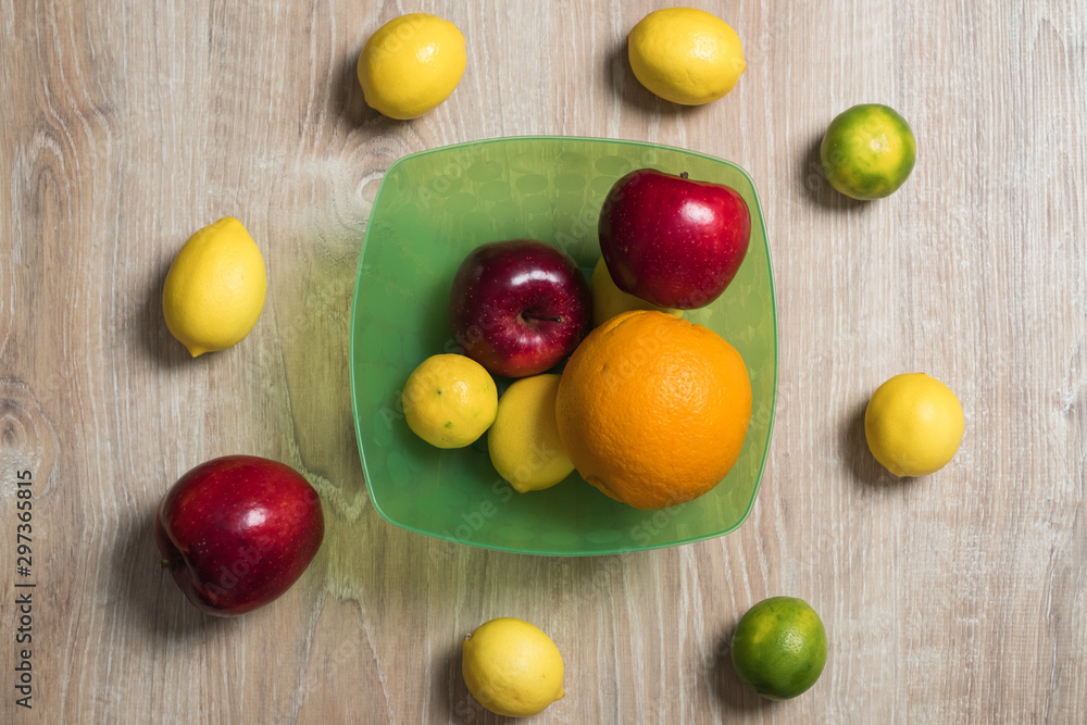 Fruit studio image. Bowl of fruit. Set of citrus fruits and red apples. Fruit studio image. Bowl of fruit. Set of citrus fruits and red apples.