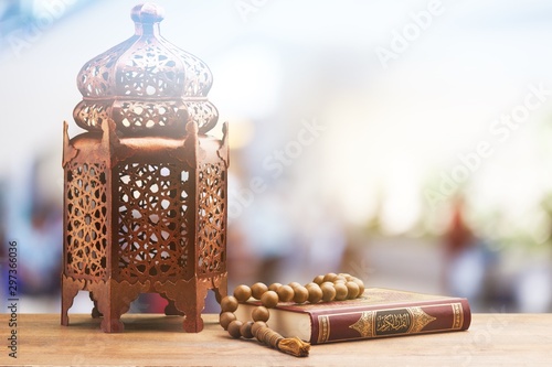 Three months.Islamic Holy Book Quran with rosary beads under soft light on White Background. Ramadan concept .