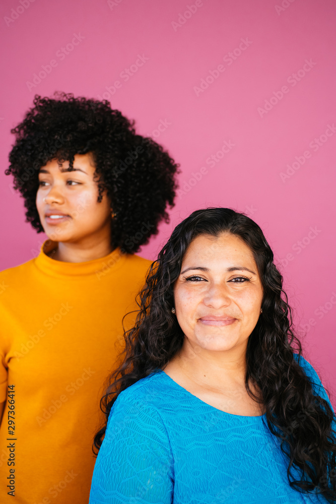 Portrait of Latina mother and daughter in studio environment Portrait of Latina mother and daughter in studio environment