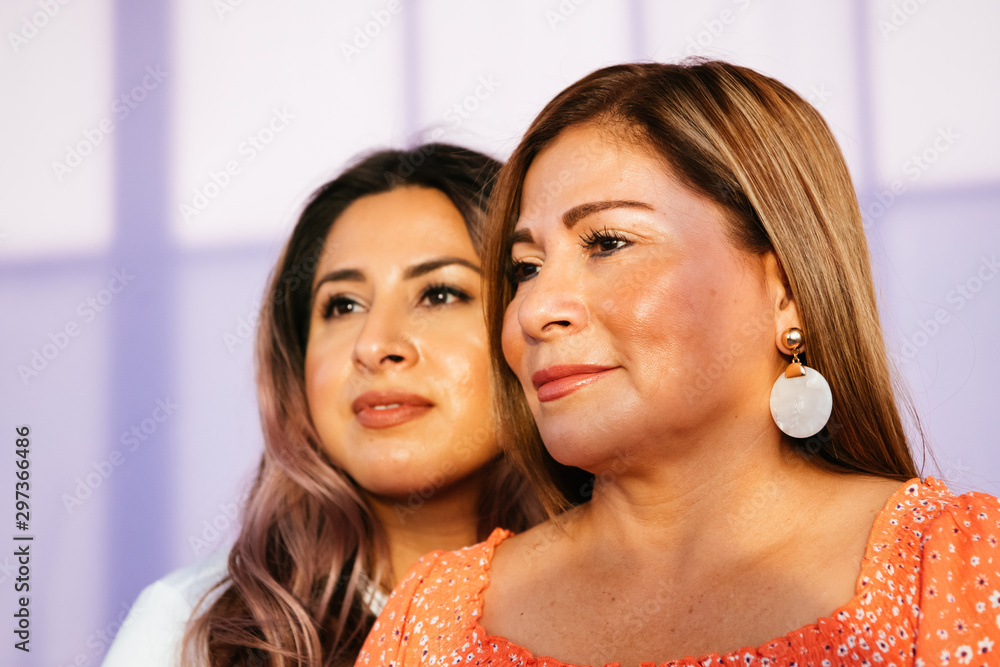 Portrait of Latina mother and daughter in studio environment Portrait of Latina mother and daughter in studio environment