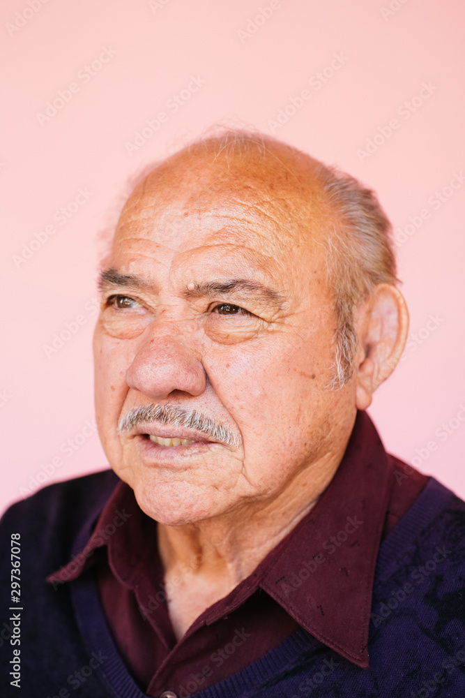 Portrait of eldery Latino grandfather in studio environment Portrait of eldery Latino grandfather in studio environment